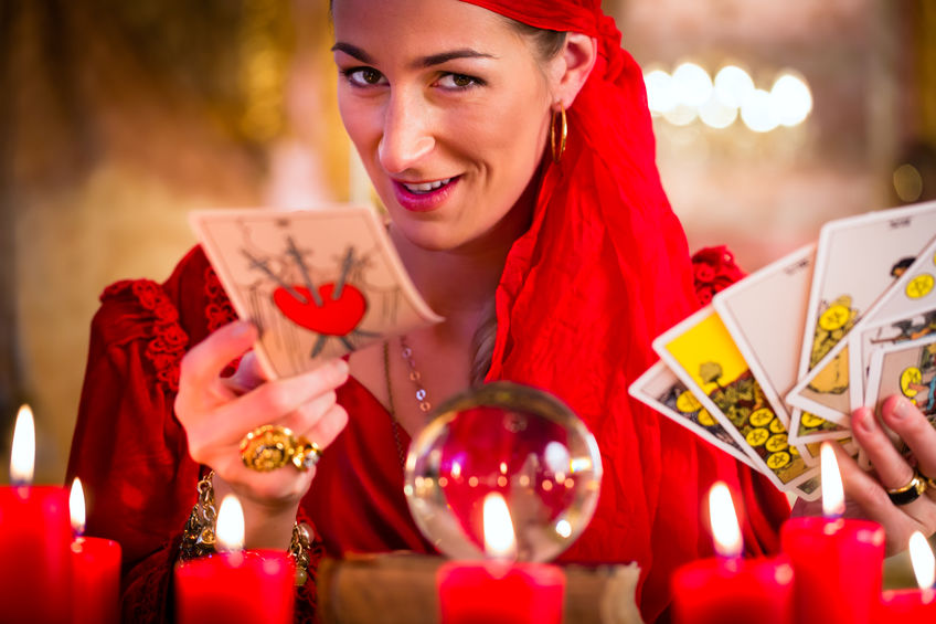 Soothsayer in Seance or session with tarot cards