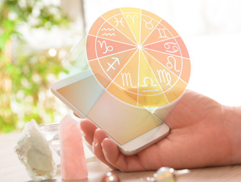 Modern astrology concept with mobile